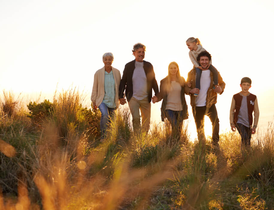 Multi generation family walking outdoors